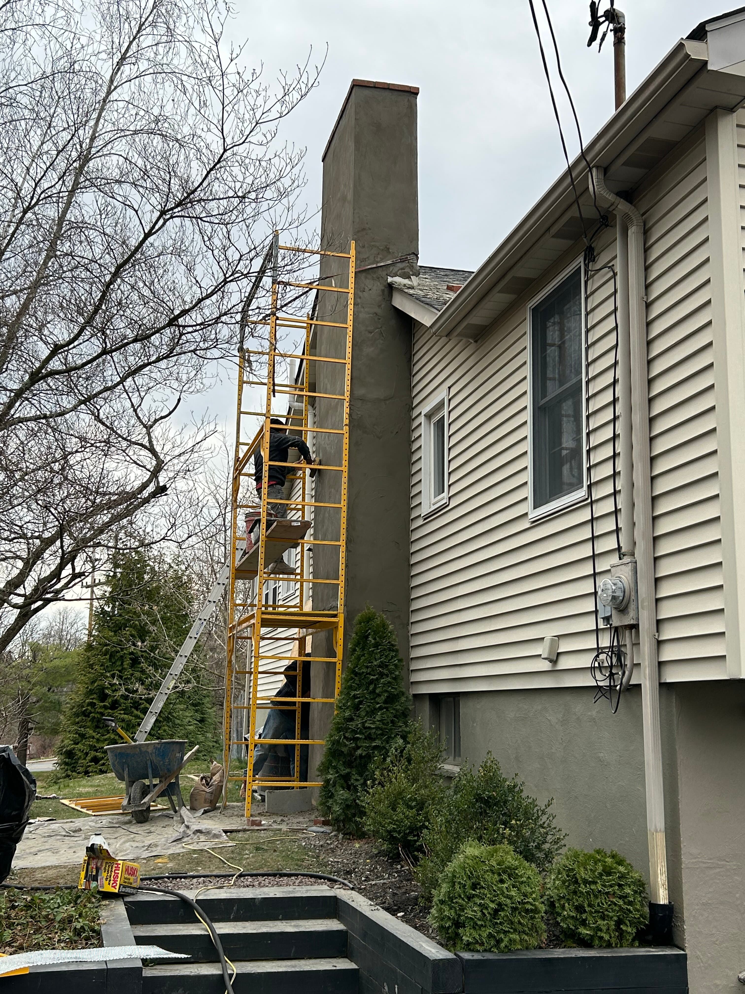 Chimney repair with scaffolding